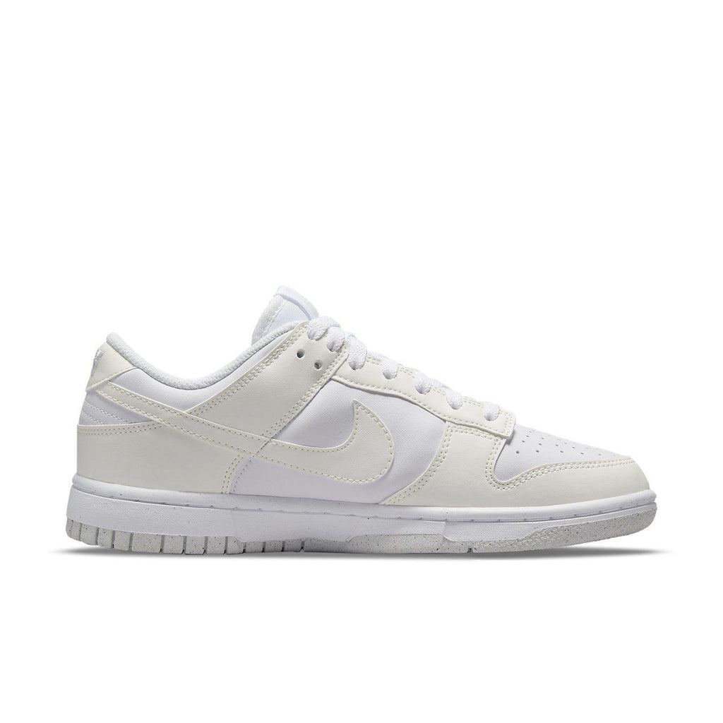 Nike Dunk Low Next Nature Sail women's sneakers in white with breathable design and Swoosh logo.
