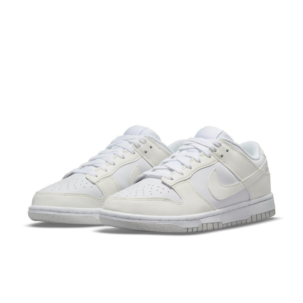 Nike Dunk Low Next Nature Sail (W) in white, featuring breathable perforations and signature Swoosh logo.