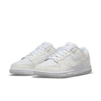 Nike Dunk Low Next Nature Sail (W) in white, featuring breathable perforations and signature Swoosh logo.