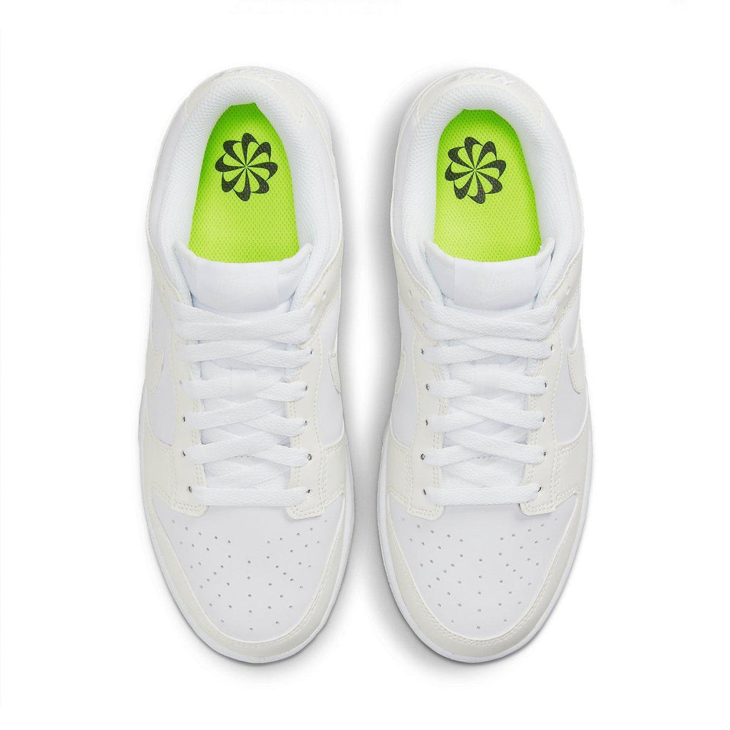 Nike Dunk Low Next Nature Sail (W) shoes with white upper and bright green insole, showcasing perforated toe design.