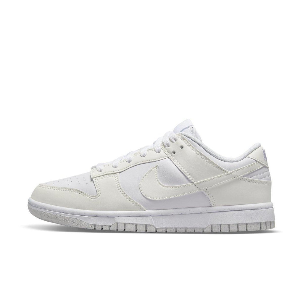 Nike Dunk Low Next Nature Sail (W) in white, featuring breathable design and textured outsole for optimal traction.