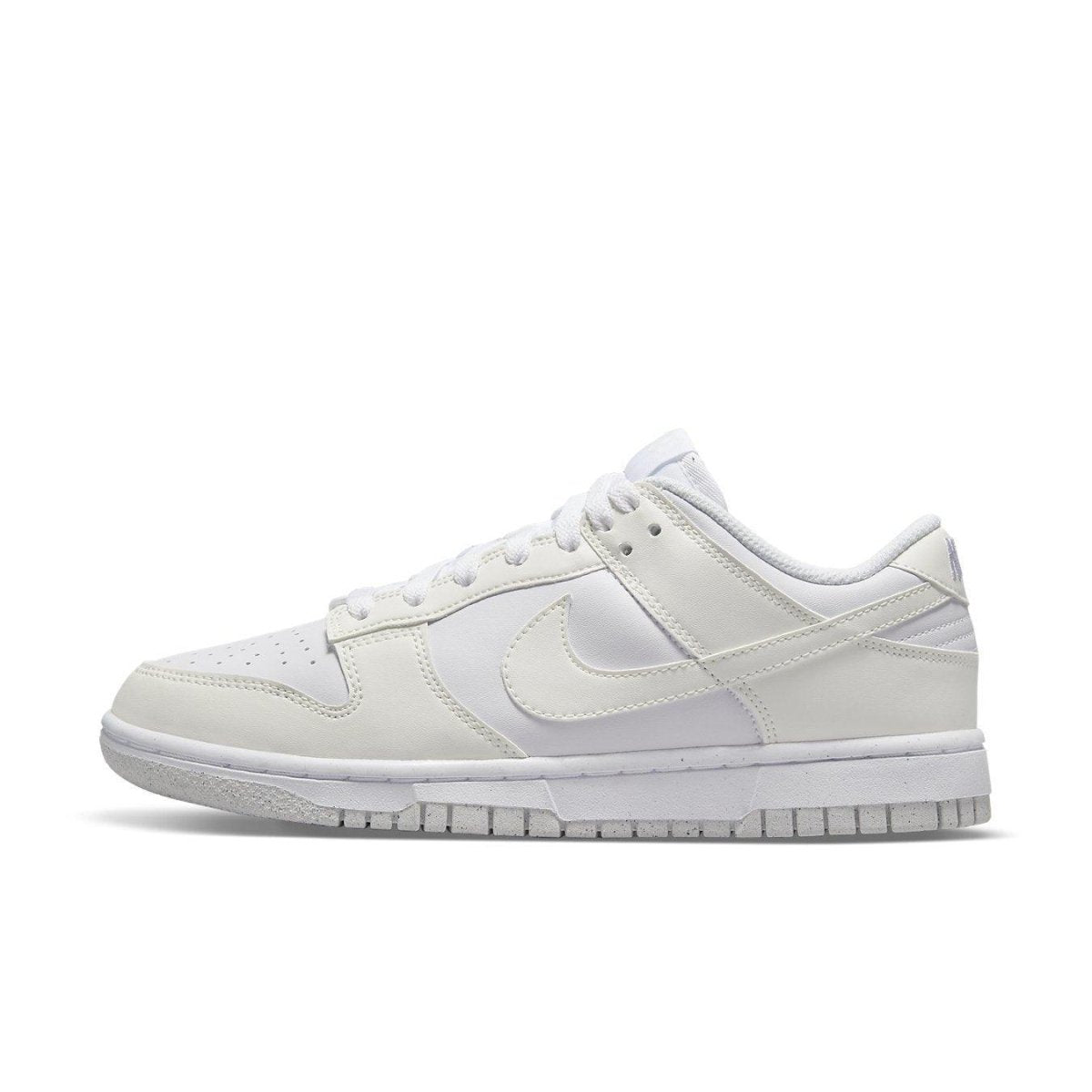 Nike Dunk Low Next Nature Sail (W) in white, featuring breathable design and textured outsole for optimal traction.