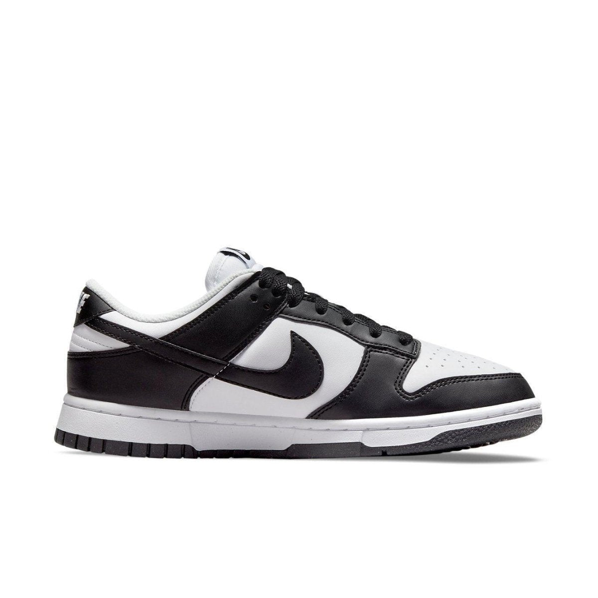 Nike Dunk Low Next Nature in white and black, featuring recycled materials and classic design elements.