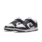 Nike Dunk Low Next Nature in white and black, featuring synthetic leather and eco-friendly design.