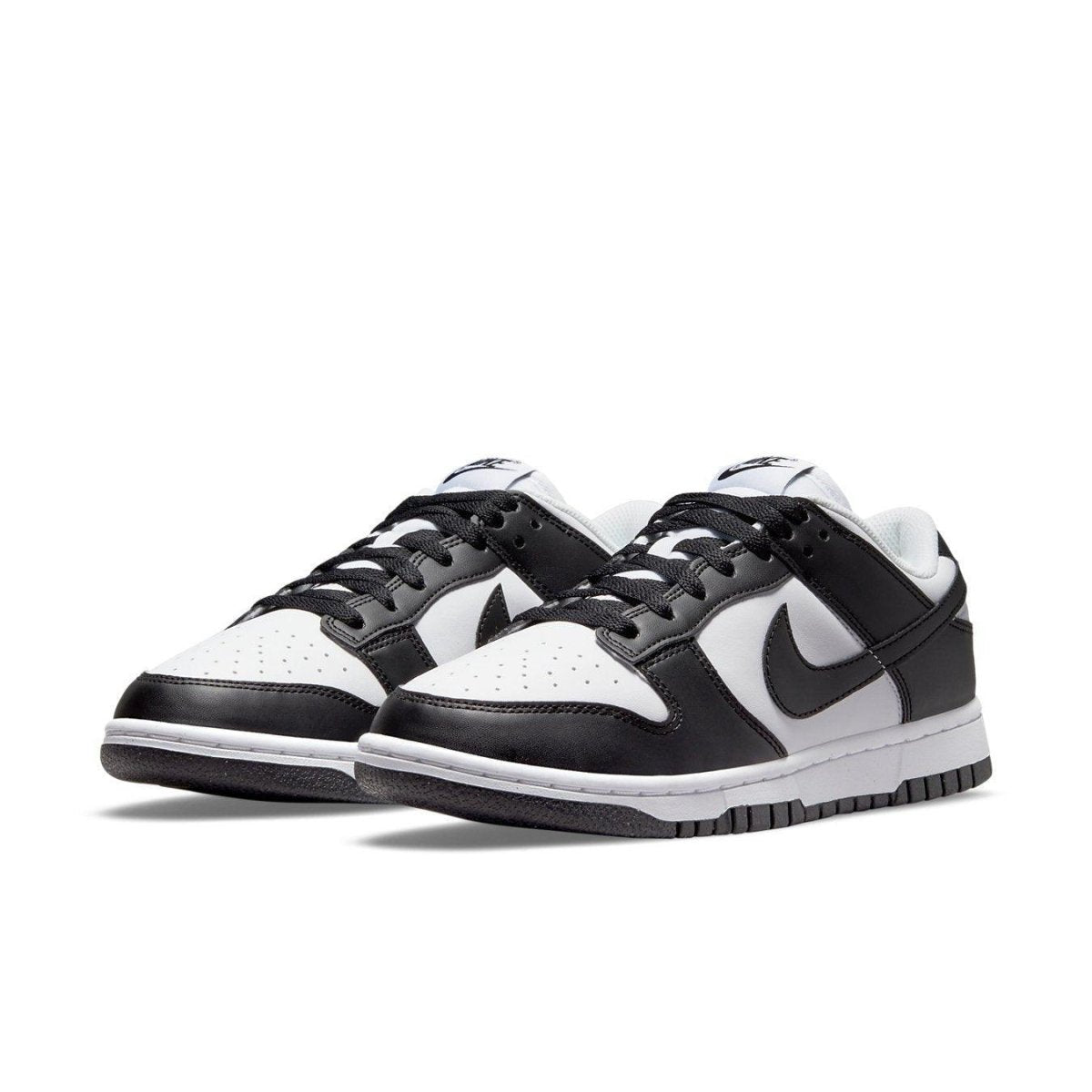 Nike Dunk Low Next Nature in white and black, featuring synthetic leather and eco-friendly design.