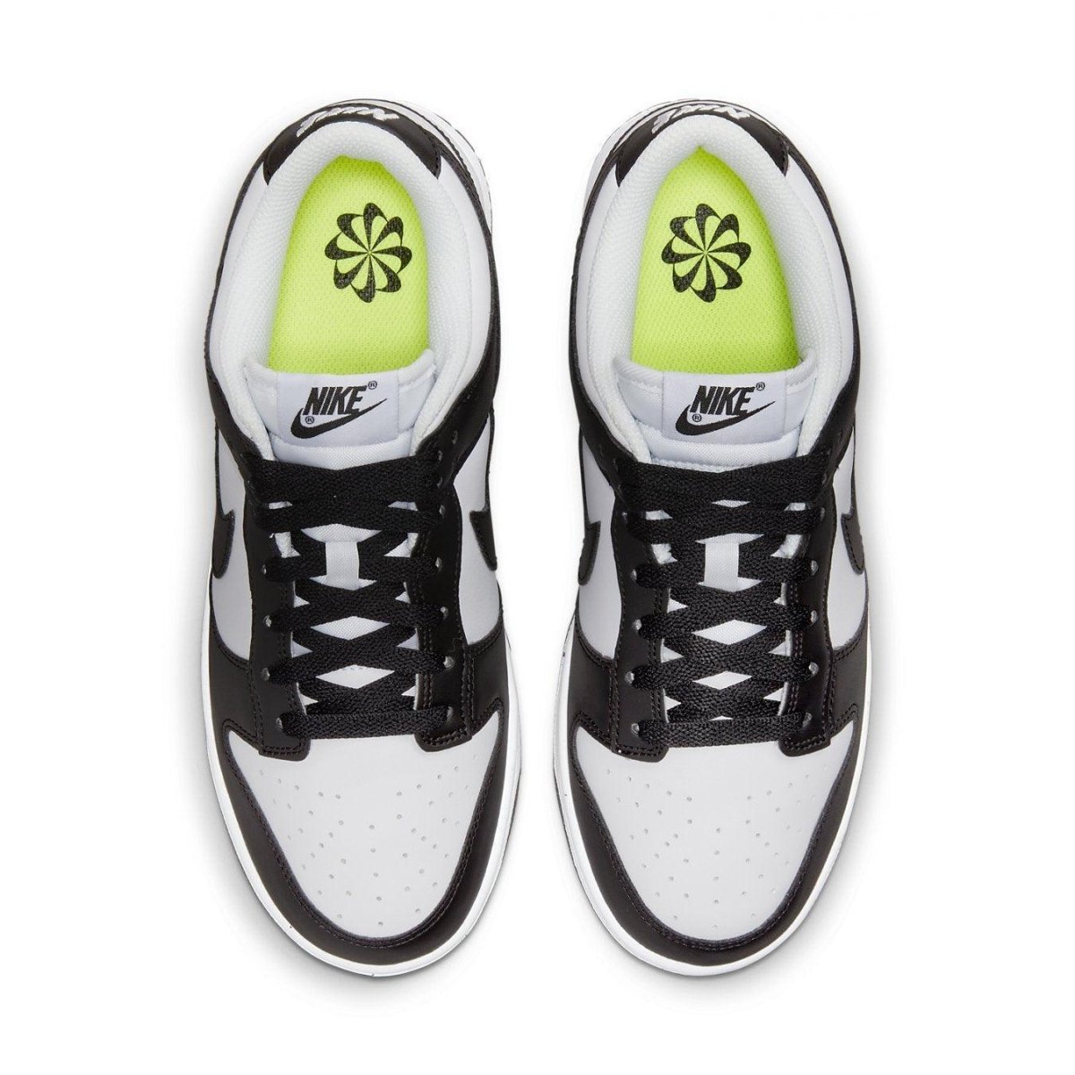 Nike Dunk Low Next Nature White Black women's sneakers featuring a synthetic leather upper and Volt insoles.