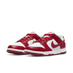 Nike Dunk Low Next Nature in white and gym red colorway, featuring leather upper and classic design.