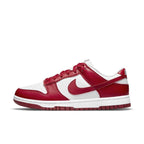Nike Dunk Low Next Nature in white and gym red, crafted with eco-friendly materials and featuring a sleek leather design.