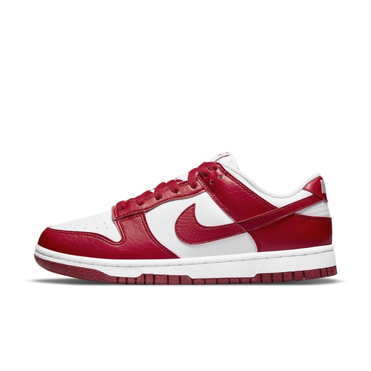 Nike Dunk Low Next Nature in white and gym red, crafted with eco-friendly materials and featuring a sleek leather design.