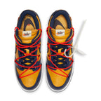 Nike Dunk Low Off-White University Gold Midnight Navy with foam tongue and waffle sole, red laces detail.
