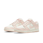 Nike Dunk Low Orange Pearl women’s sneakers featuring soft pink and cream design.