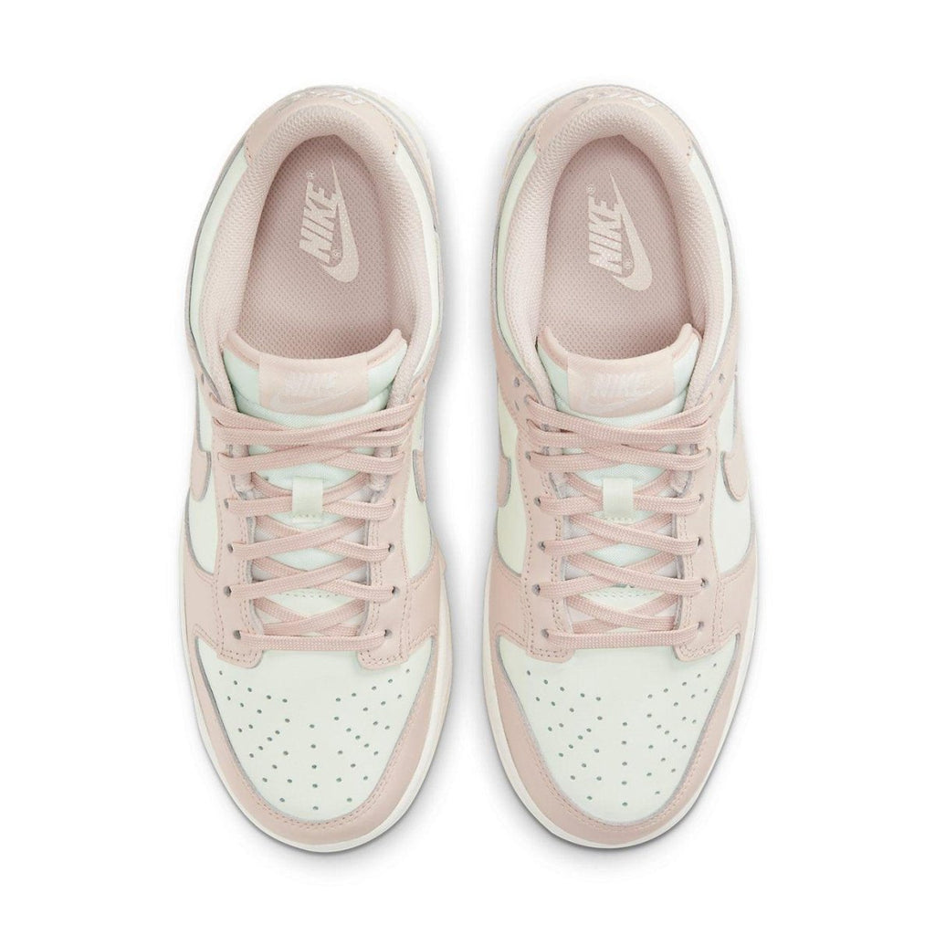 Nike Dunk Low Orange Pearl (W) sneakers in pink and white from above view.