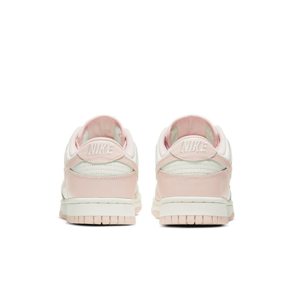 Nike Dunk Low Orange Pearl (W) women's sneakers, back view showcasing soft pink accents and iconic branding.