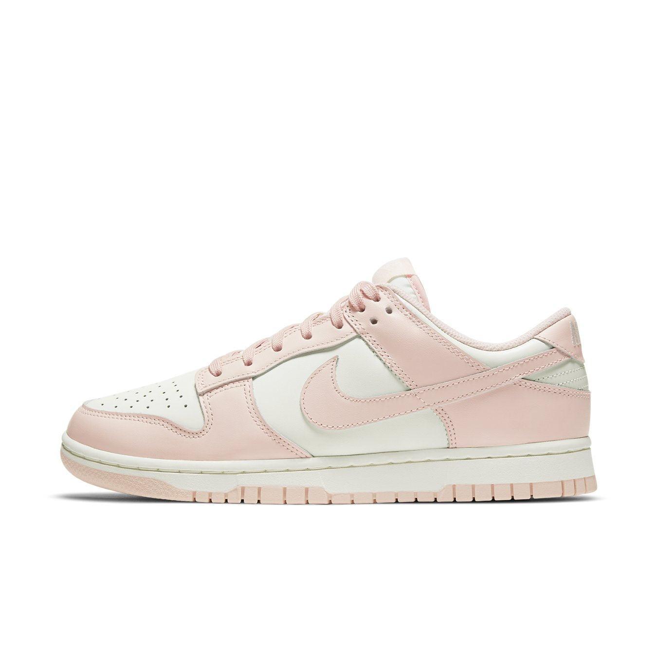 Nike Dunk Low Orange Pearl (W) sneakers in pink and white, featuring classic design and premium materials.