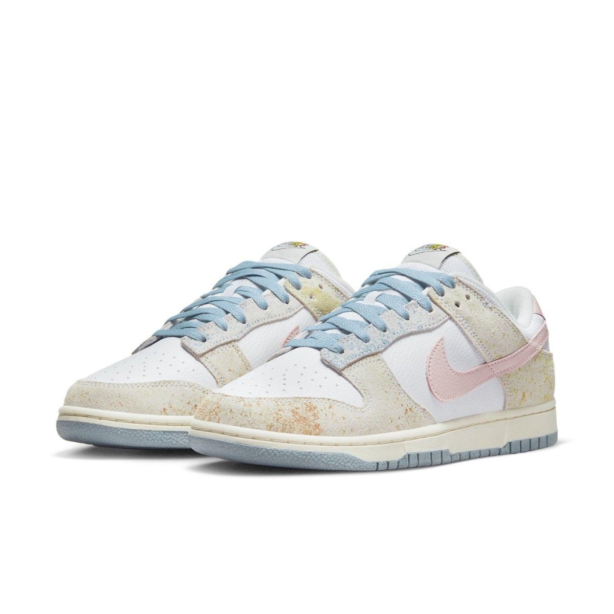 Nike Dunk Low Oxidized in pastel tones with blue, pink, and yellow detailing, featuring a faded suede look.