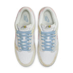 Nike Dunk Low Oxidized sneakers featuring pastel colors, light blue laces, and a vintage suede finish.