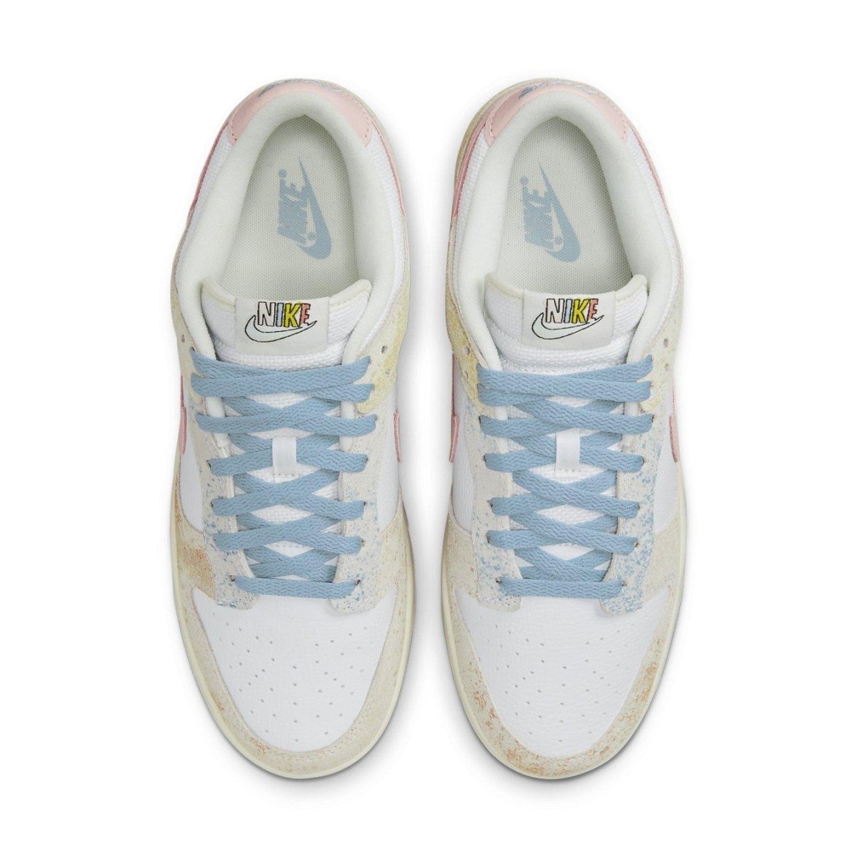 Nike Dunk Low Oxidized sneakers featuring pastel colors, light blue laces, and a vintage suede finish.
