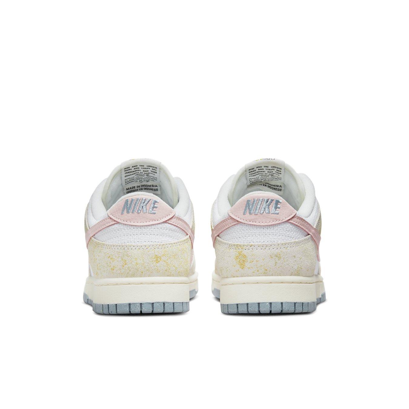 Retro Nike Dunk Low Oxidized back view showcasing pastel pink and faded yellow accents.