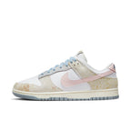 Nike Dunk Low Oxidized in pastel tones of blue, pink, and light yellow with a worn suede finish.