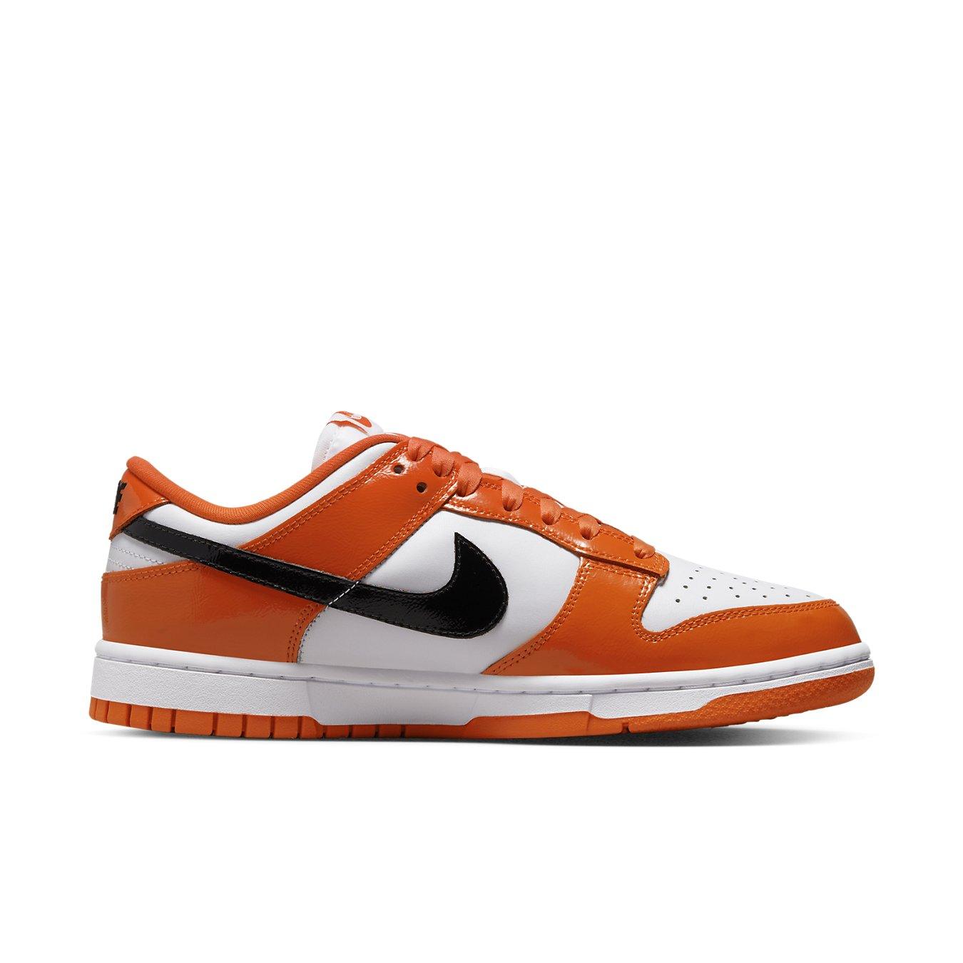 Nike Dunk Low Patent Halloween sneakers in orange and white with black Swoosh, perfect for a festive look.
