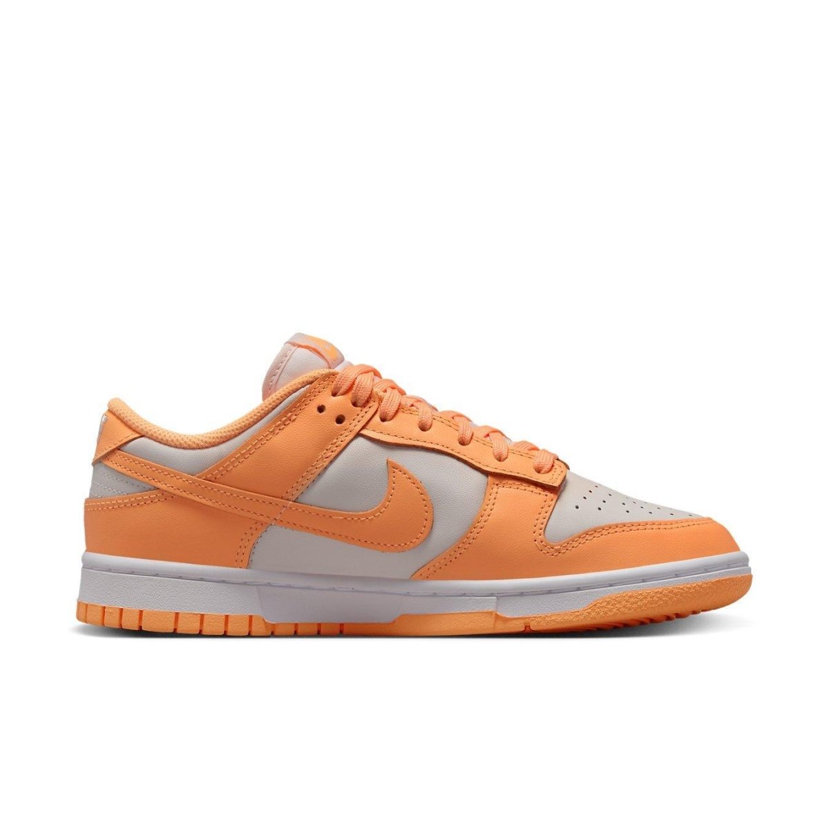 Nike Dunk Low Peach Cream sneakers with white and peach-orange colorway, showcasing the sneaker's sleek design.