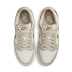 Nike Dunk Low Phantom Metallic Gold women's sneakers in smooth white leather with beige accents and gold details.