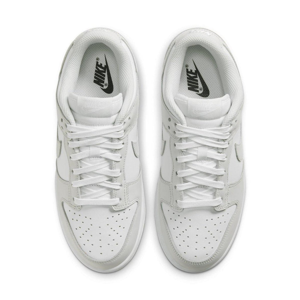 Nike Dunk Low Photon Dust (W) top view, featuring a sleek white design and classic lacing.