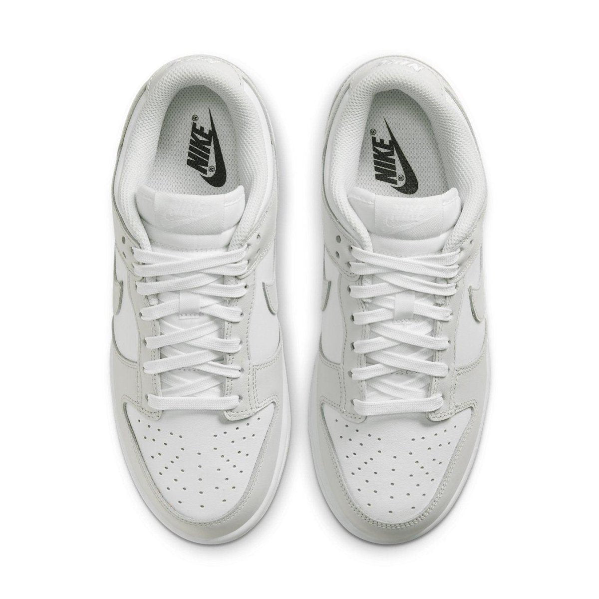 Nike Dunk Low Photon Dust (W) top view, featuring a sleek white design and classic lacing.