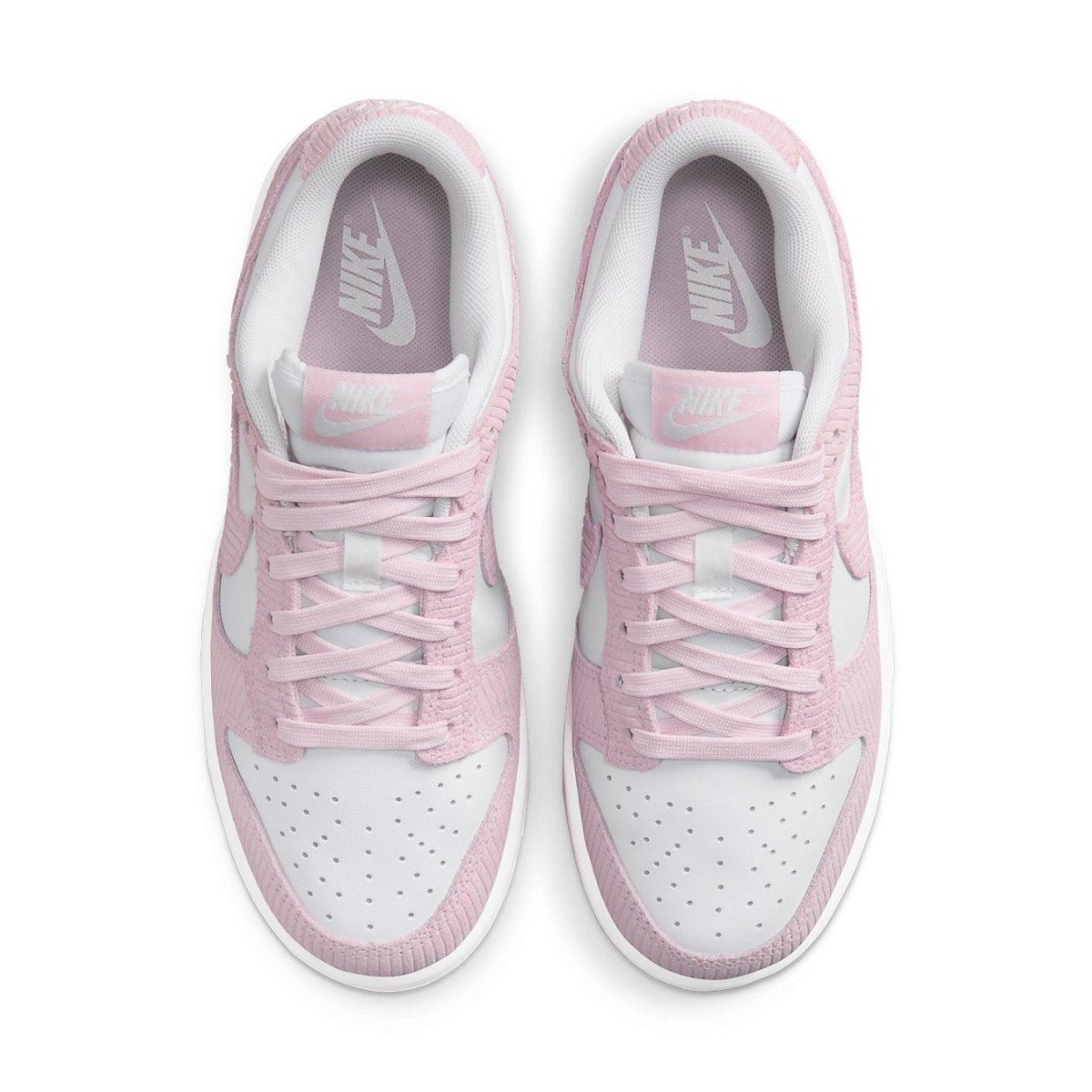 Nike Dunk Low Pink Corduroy Women's sneakers featuring pastel pink corduroy and smooth leather accents.