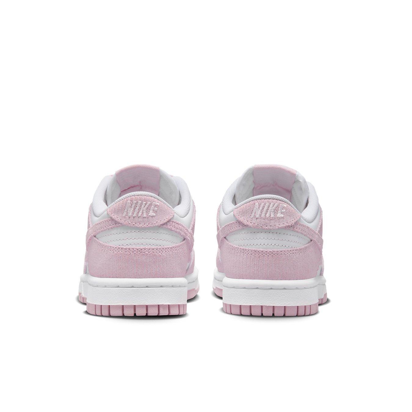 Nike Dunk Low Pink Corduroy Women's sneaker rear view with pastel pink accents and white leather base.