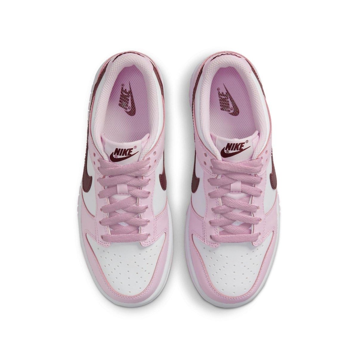 Nike Dunk Low Pink Foam Red White (GS) sneakers with pink overlays and deep red Swoosh, viewed from above.
