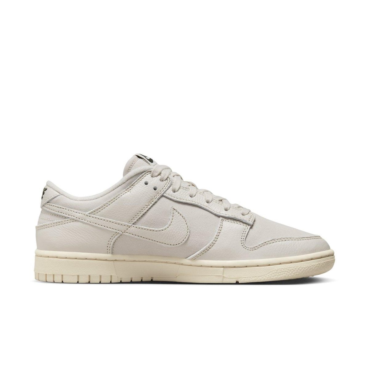 Nike Dunk Low Premium Light Orewood Brown in light ivory with breathable canvas and leather overlays.
