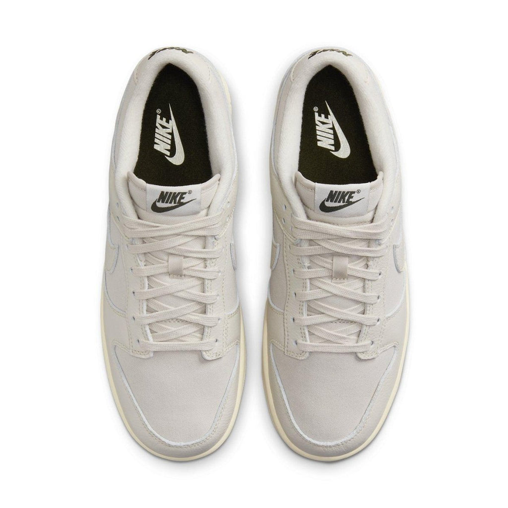 Nike Dunk Low Premium Light Orewood Brown shoes from top view, featuring ivory canvas and leather overlays.