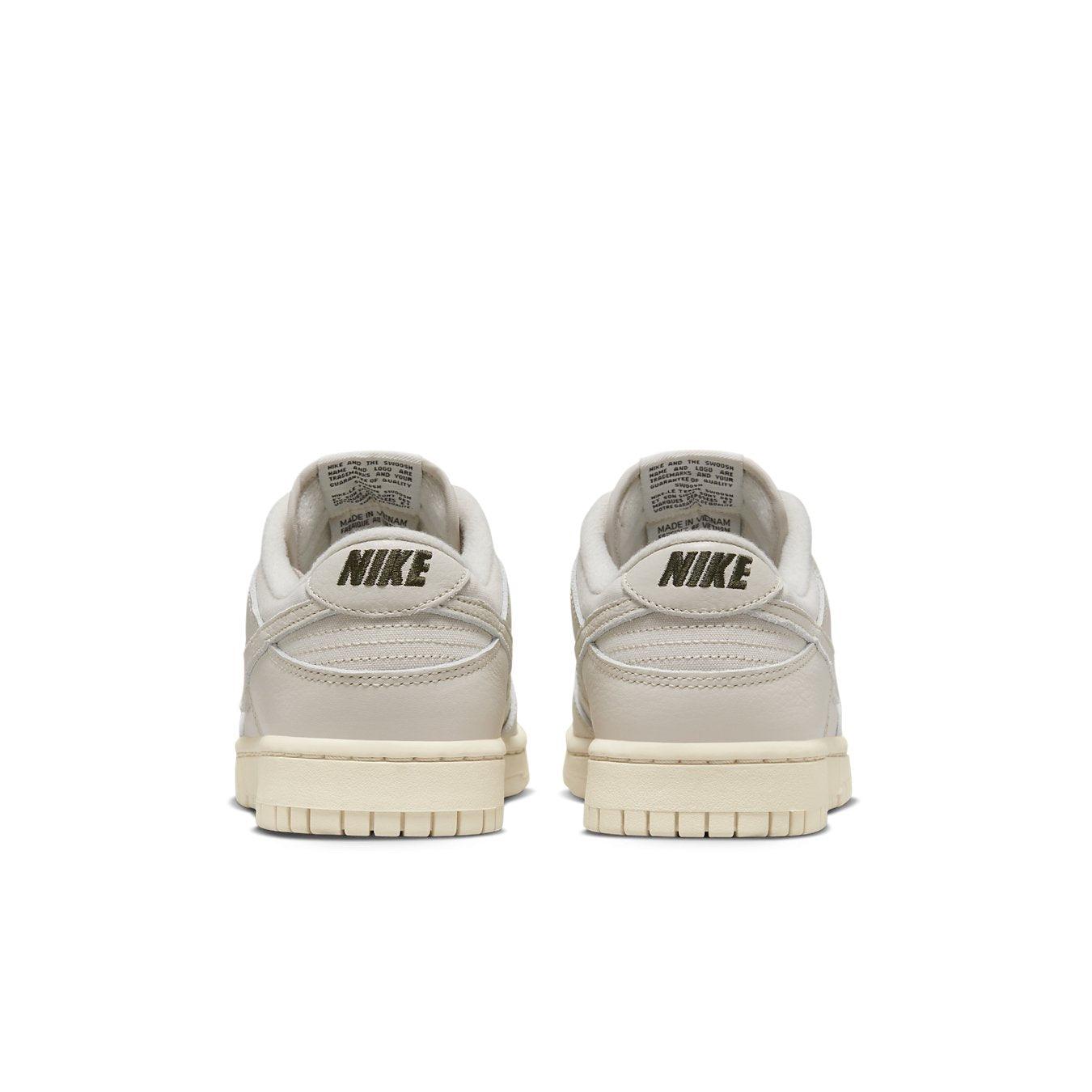 Nike Dunk Low Premium Light Orewood Brown sneakers rear view showcasing breathable canvas and leather details.