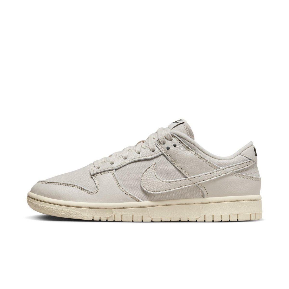 Nike Dunk Low Premium Light Orewood Brown sneaker featuring a breathable ivory canvas upper and leather overlays.