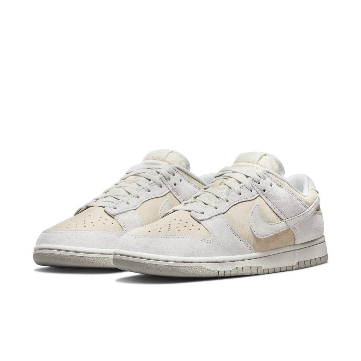 Nike Dunk Low Premium Vast Grey sneakers in beige and grey suede with signature Swoosh logo.