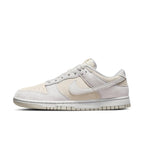 Nike Dunk Low Premium Vast Grey sneakers featuring beige and grey suede upper with classic design elements.