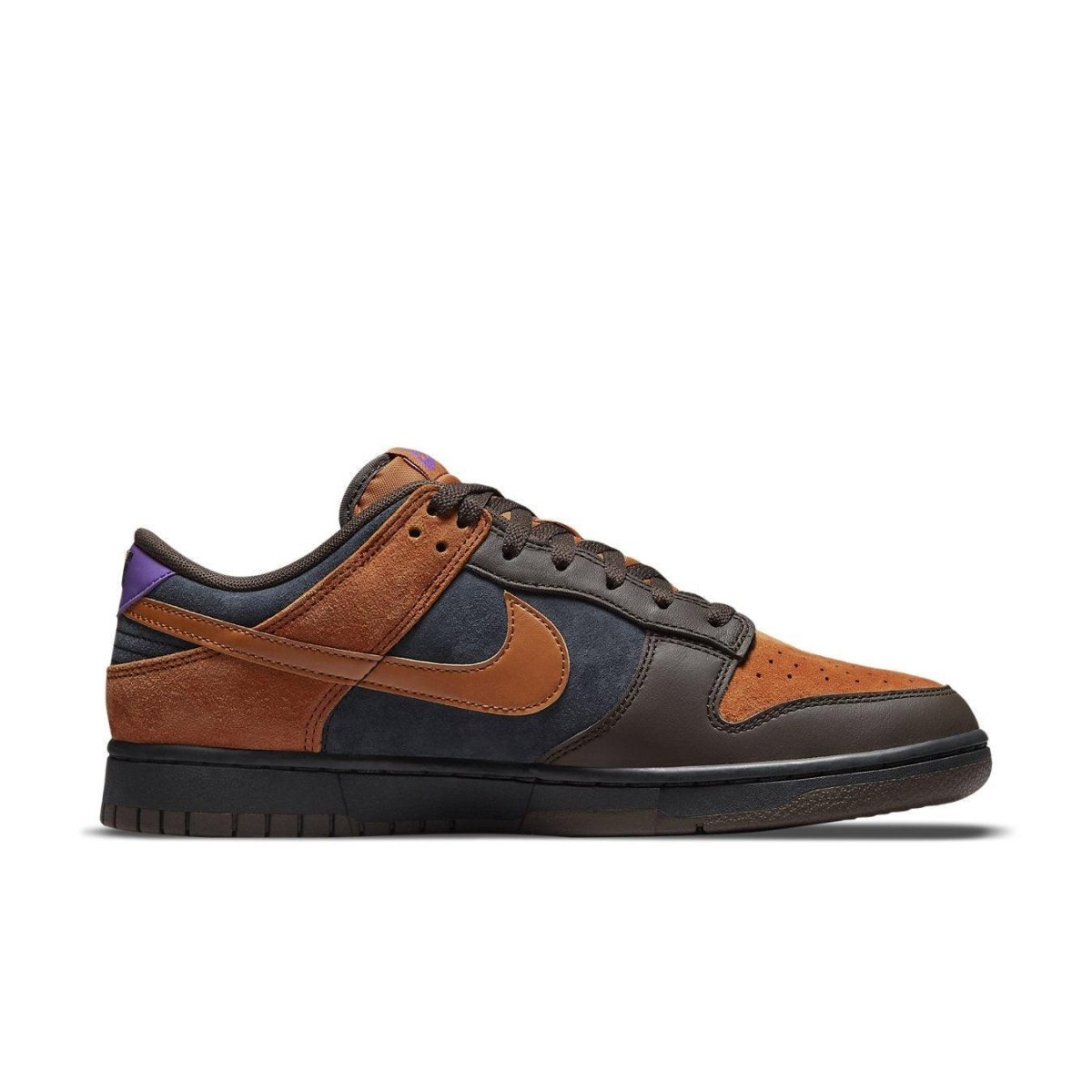 Nike Dunk Low PRM Cider in burnt orange and brown suede with navy accents, showcasing a modern sneaker design.