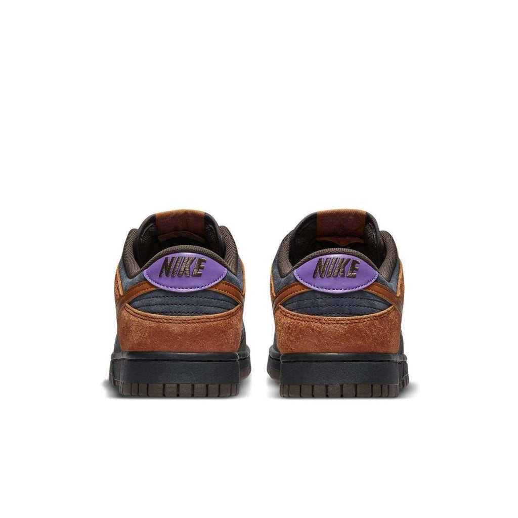 Nike Dunk Low PRM Cider sneakers featuring burnt orange suede and sleek brown leather, with purple accents on the heel.