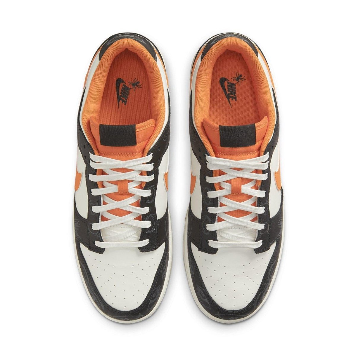 Nike Dunk Low PRM Halloween 2021 sneakers featuring black and white panels with vibrant orange Swoosh.