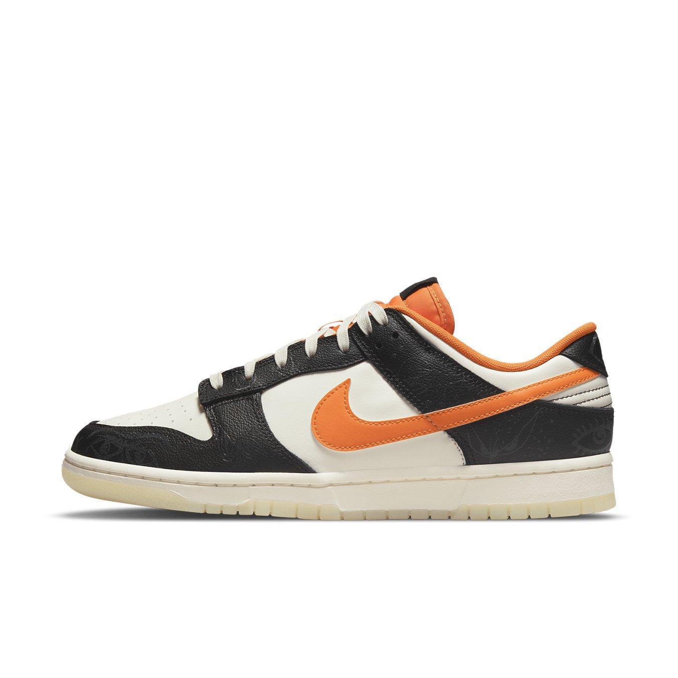 Nike Dunk Low PRM Halloween 2021 with black and white panels and vibrant orange Swoosh.