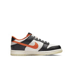 Nike Dunk Low PRM Halloween (2021) GS in orange, black, and white colorway, featuring detailed design and festive theme.