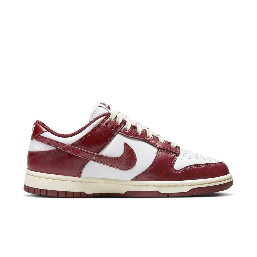 Nike Dunk Low PRM Vintage Team Red sneaker featuring premium leather and retro-inspired design.