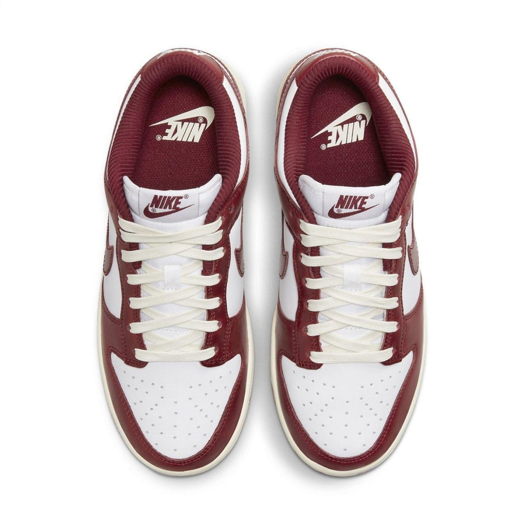 Nike Dunk Low PRM Vintage Team Red women's sneakers with premium leather and retro design.