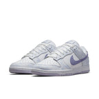 Nike Dunk Low Purple Pulse sneakers featuring tie-dye purple and yellow accents on a white base.