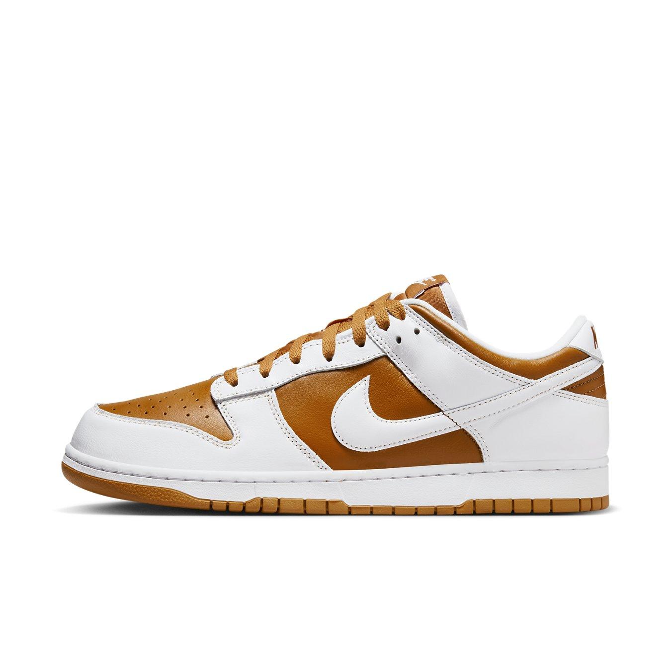 Nike Dunk Low QS CO.JP Reverse Curry 2024 sneaker in brown and white leather with classic design features.