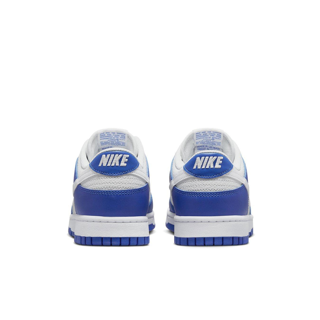 Nike Dunk Low Racer Blue Photon Dust sneakers viewed from the back, featuring a blue and white colorway with iconic Nike branding.