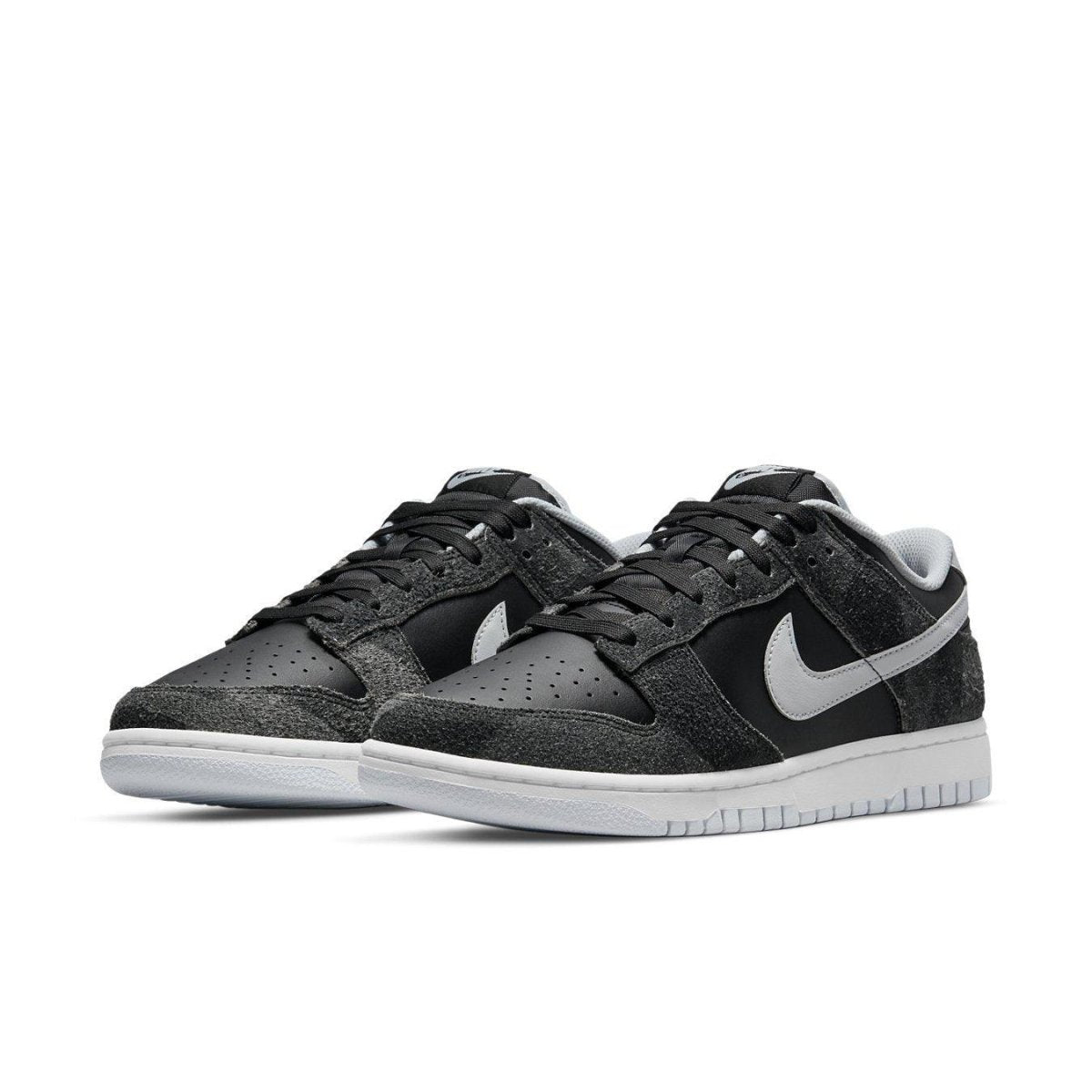 Nike Dunk Low Retro Animal Pack Zebra sneakers with black and gray color blocking and white Swoosh.
