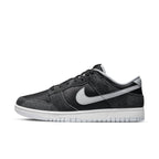 Nike Dunk Low Retro Animal Pack Zebra in black and gray with white sole, showcasing sleek sneaker design.