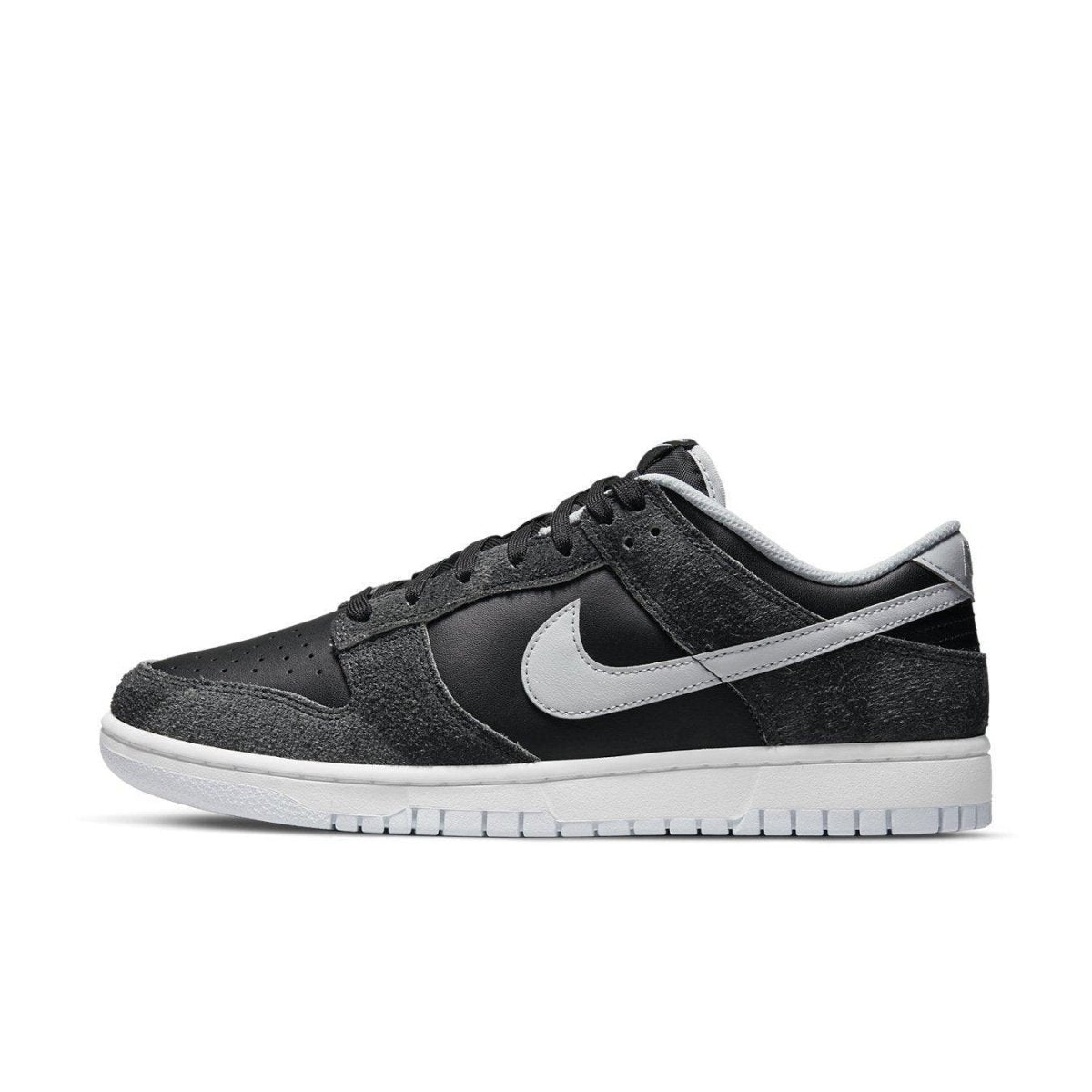 Nike Dunk Low Retro Animal Pack Zebra in black and gray with white sole, showcasing sleek sneaker design.